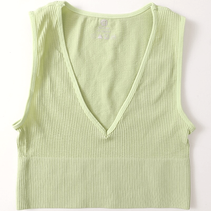 Light green women's ribbed seamless tank top with deep V-neck, perfect for yoga, sport, and running. Made with breathable polyester and spandex.